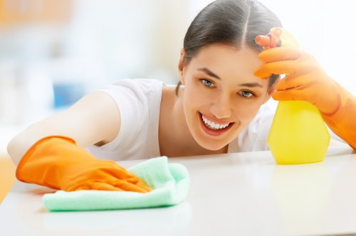 Technician treating stains during mattress cleaning in Shoreditch