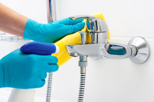 Cleaning technician preparing carpet cleaning equipment safely